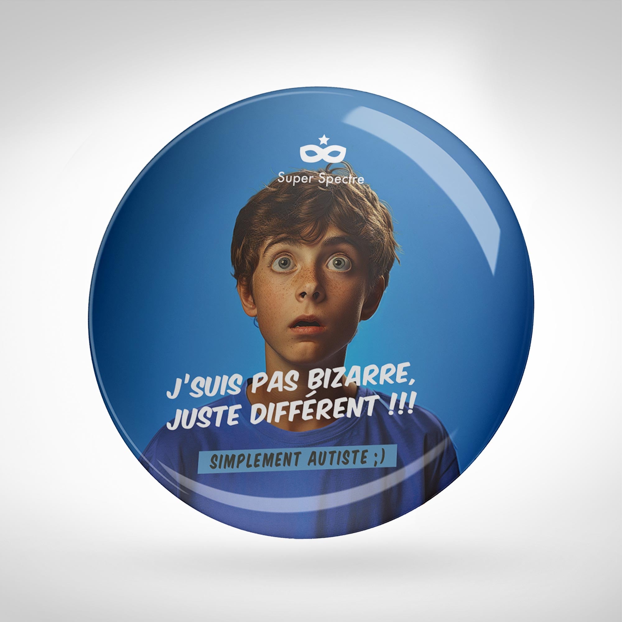 Badge de sensibilisation "J'suis pas bizarre, juste différent !!!" - Ø 75mm